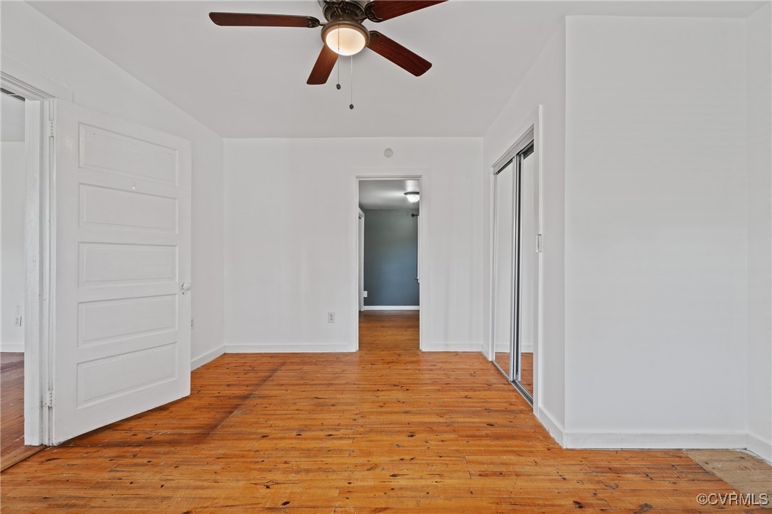6405 King William Road Aylett, VA 23009 - Photo 22 of 40 Unfurnished room with ceiling fan and light hardwo