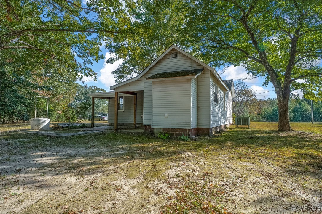 6405 King William Road Aylett, VA 23009 - Photo 28 of 40 View of property exterior featuring a lawn and cen