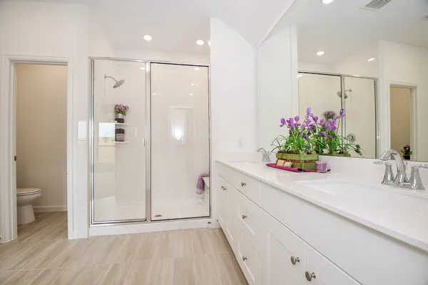 a bathroom with a shower and a sink