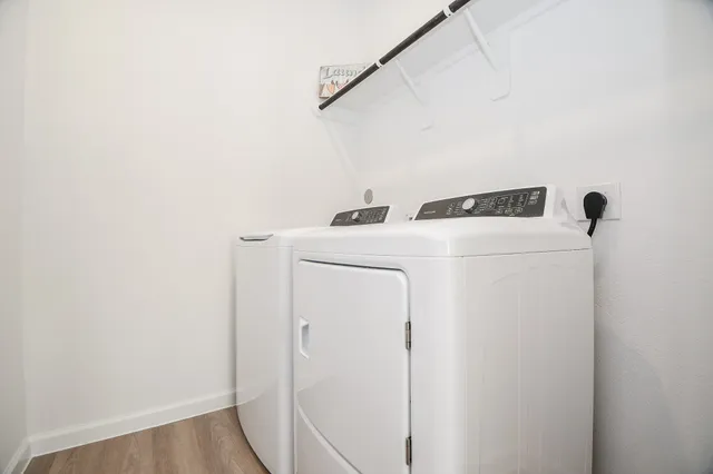 a utility room with dryer and washer