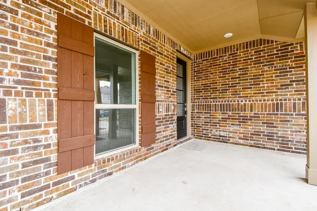 a view of a brick building with many windows