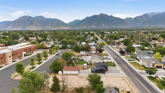 388 Wasatch Street Midvale, UT 84047 - Photo 4 of 13 Residential neighborhood with mature trees, established roads, and distant mountain ranges