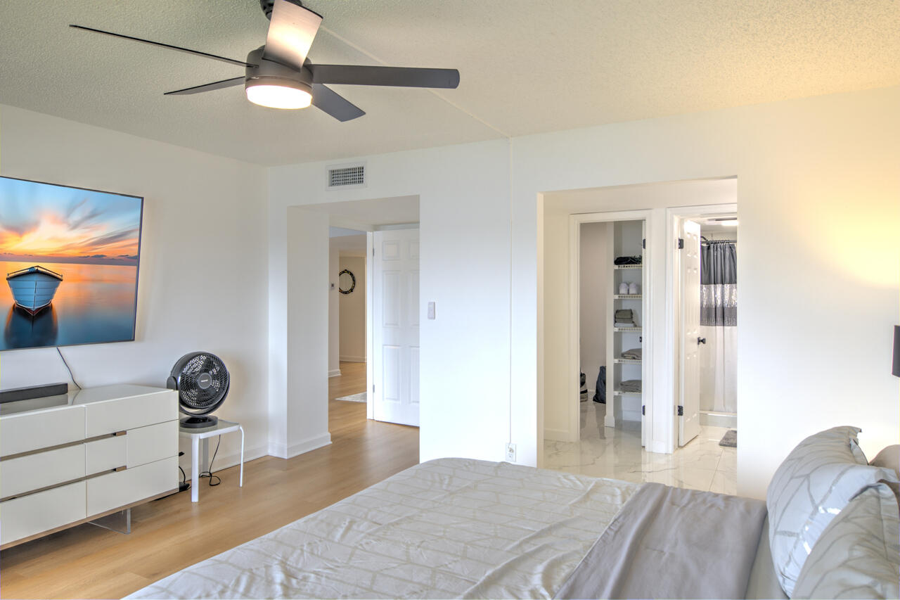 3040 Lake Shore Drive, Unit 305 Riviera Beach, FL 33404 - Photo 16 of 24 21-Still-Primary-Bedroom-3