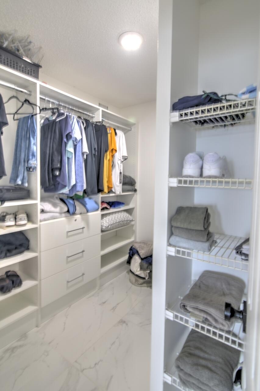 3040 Lake Shore Drive, Unit 305 Riviera Beach, FL 33404 - Photo 17 of 24 23-Still-Primary-Bed-Closet
