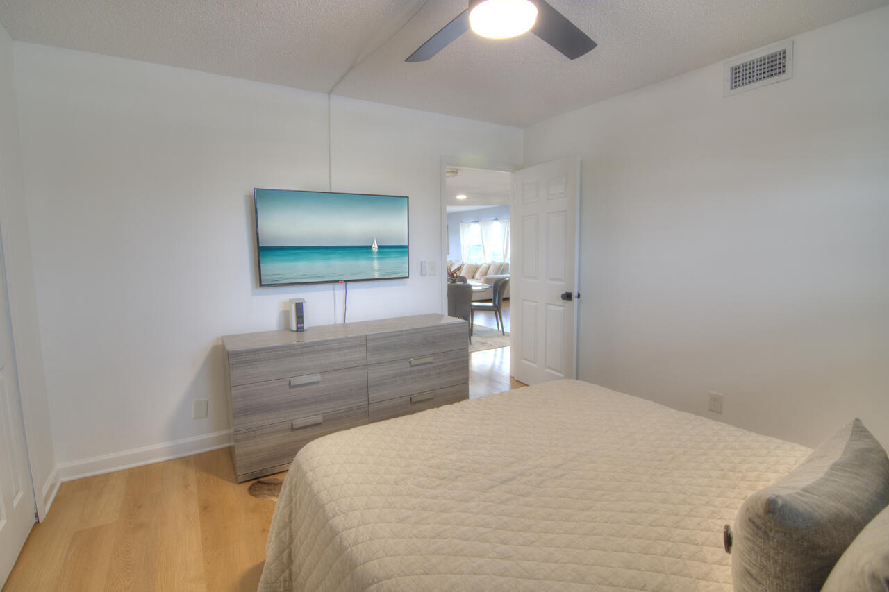 3040 Lake Shore Drive, Unit 305 Riviera Beach, FL 33404 - Photo 20 of 24 31-Still-Bedroom-2-1