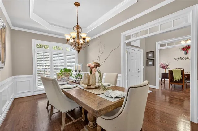 a living room with furniture a fireplace and a large window