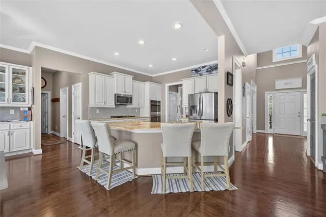a view of a hallway with couches and painted walls