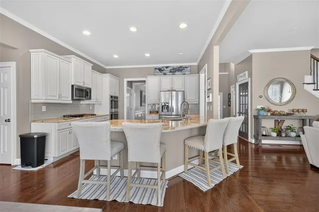 a spacious bedroom with a bed and a window