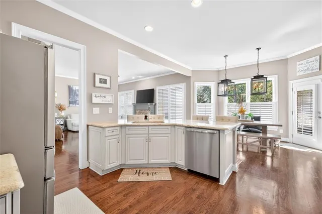 a view of walk in closet with clothes