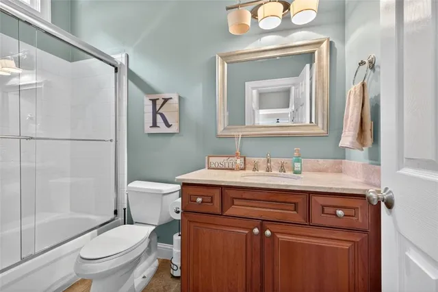 a bedroom with furniture and a chandelier