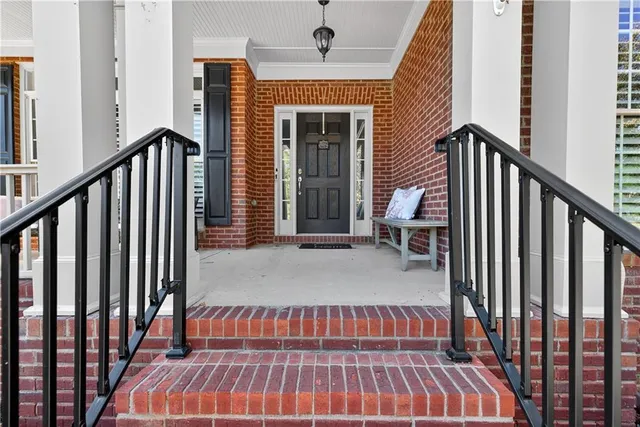 a view of a hallway view with wooden floor and workspace