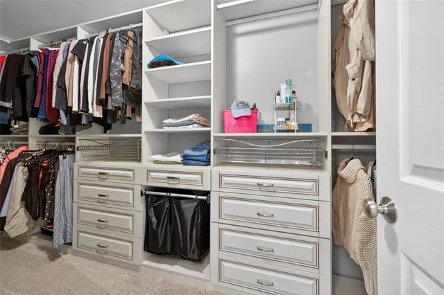 a front view of a house with a yard yard and trees