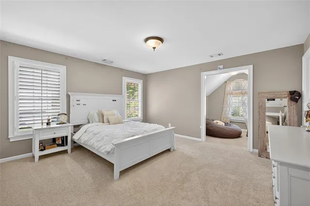a aerial view of a house with yard and green space