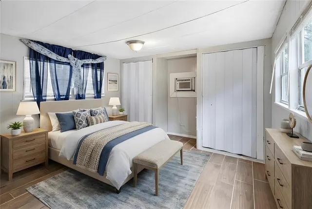 a bedroom with a large bed and a window