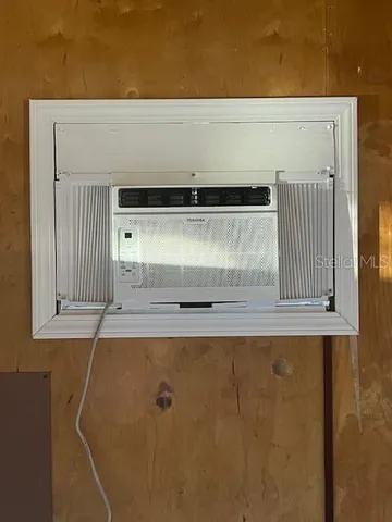 a wooden bench sitting in front of a house