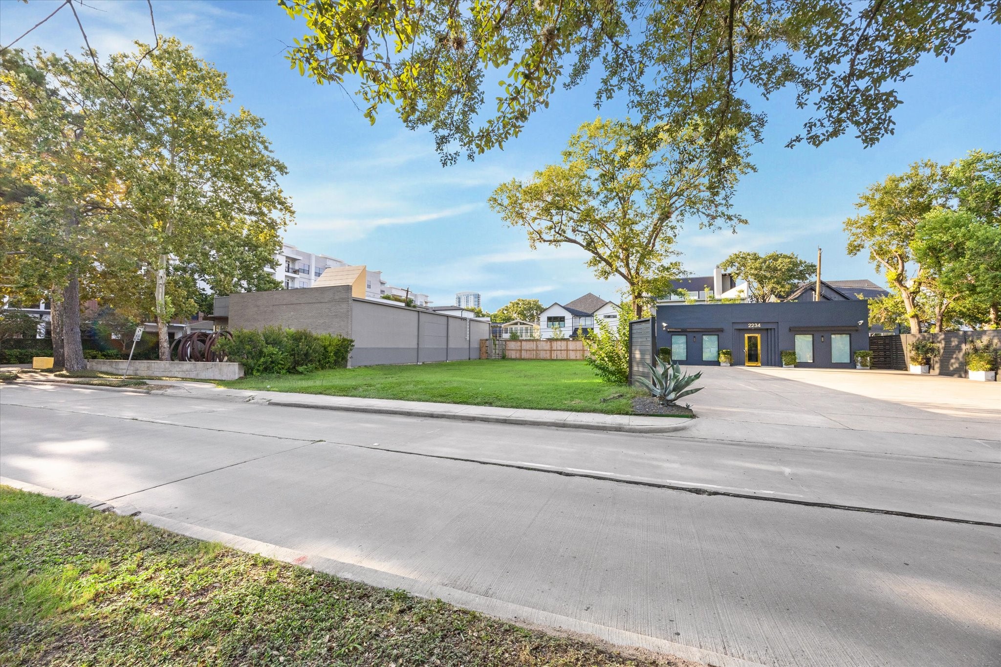 2238 Richmond Avenue Houston, TX 77098 - Photo 10 of 14 a front view of a house with a yard and potted plants