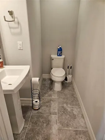 a bathroom with a toilet and a sink