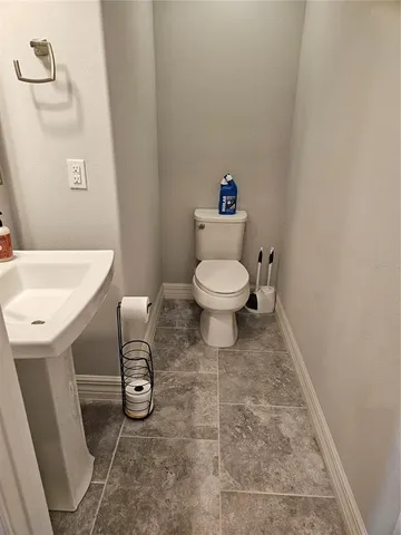 a bathroom with a toilet and a sink