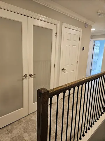 a view of a hallway with wooden floor