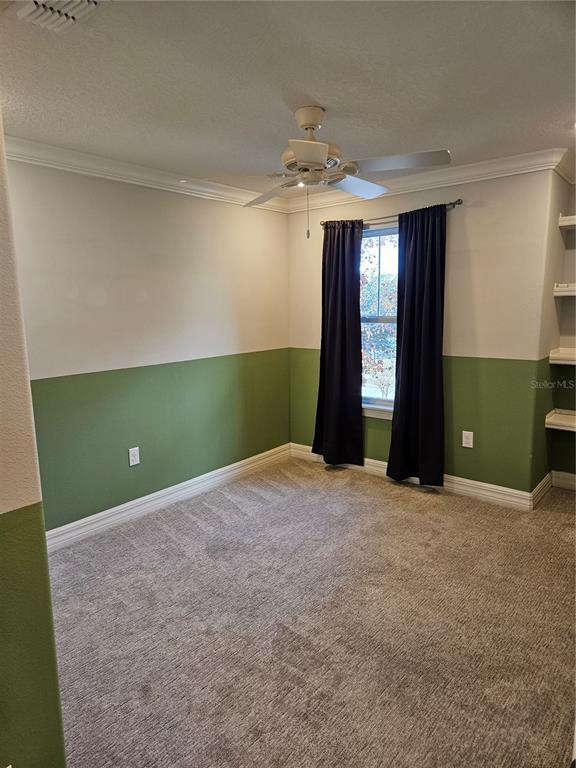 2812 Cello Lane Kissimmee, FL 34741 - Photo 16 of 34 a view of an empty room with a window