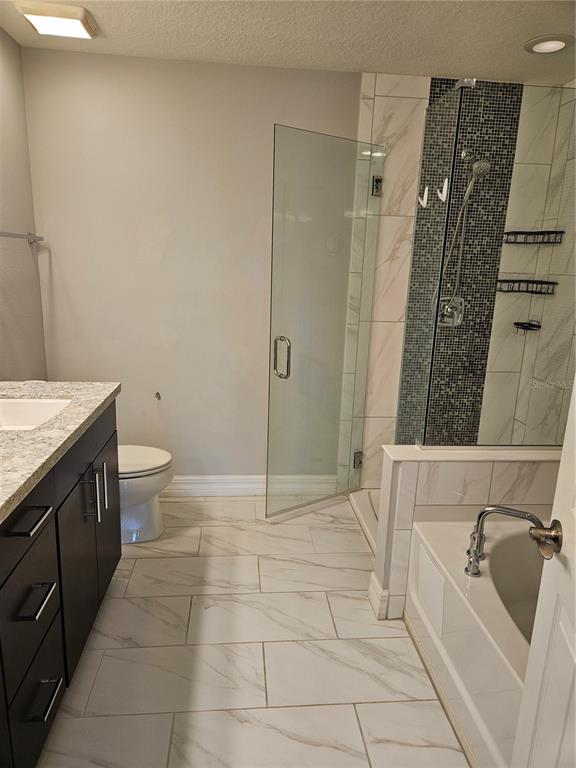 2812 Cello Lane Kissimmee, FL 34741 - Photo 19 of 34 a bathroom with a sink a toilet and shower