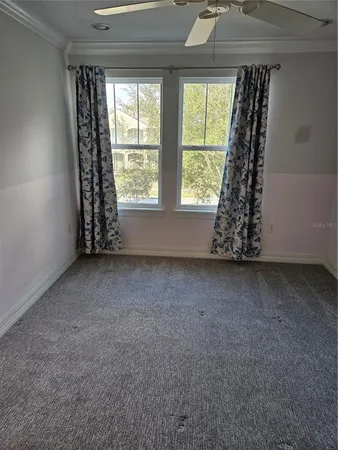 an empty room with windows and a window