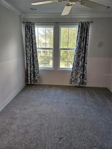 an empty room with windows and a window