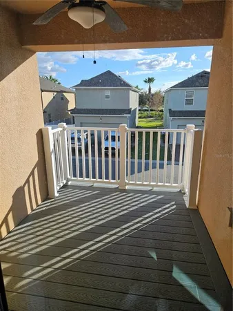 a view of a balcony with wooden floor