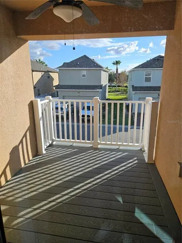 a view of a balcony with wooden floor