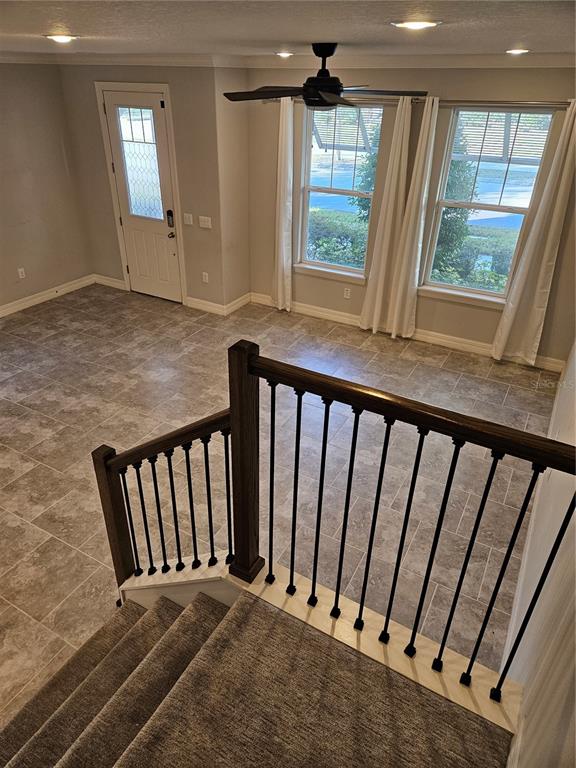 2812 Cello Lane Kissimmee, FL 34741 - Photo 6 of 34 a view of a porch with wooden floor and windows