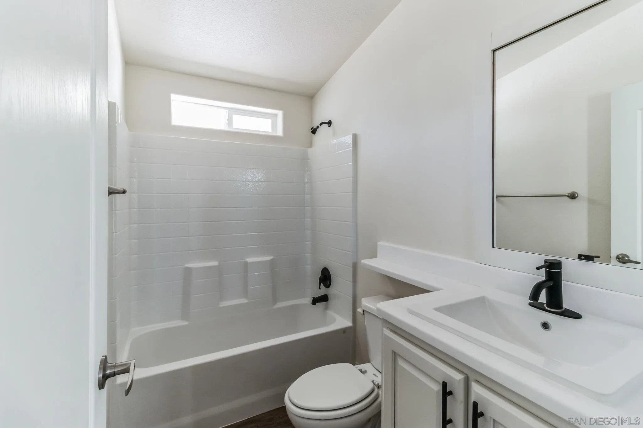 22899 Byron Road, Unit 81 Crestline, CA 92325 - Photo 4 of 9 a bathroom with a sink toilet and shower