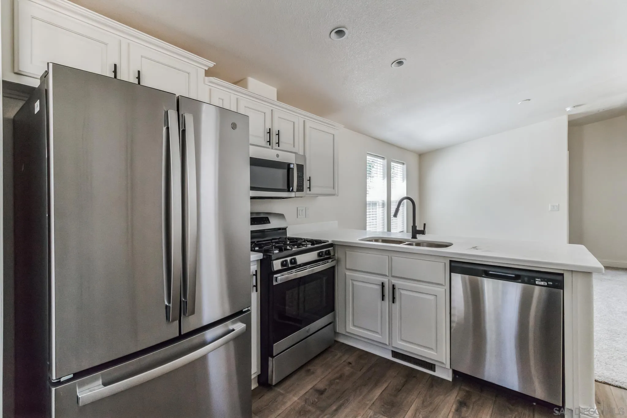 22899 Byron Road, Unit 81 Crestline, CA 92325 - Photo 9 of 9 a kitchen with stainless steel appliances a refrigerator stove and sink