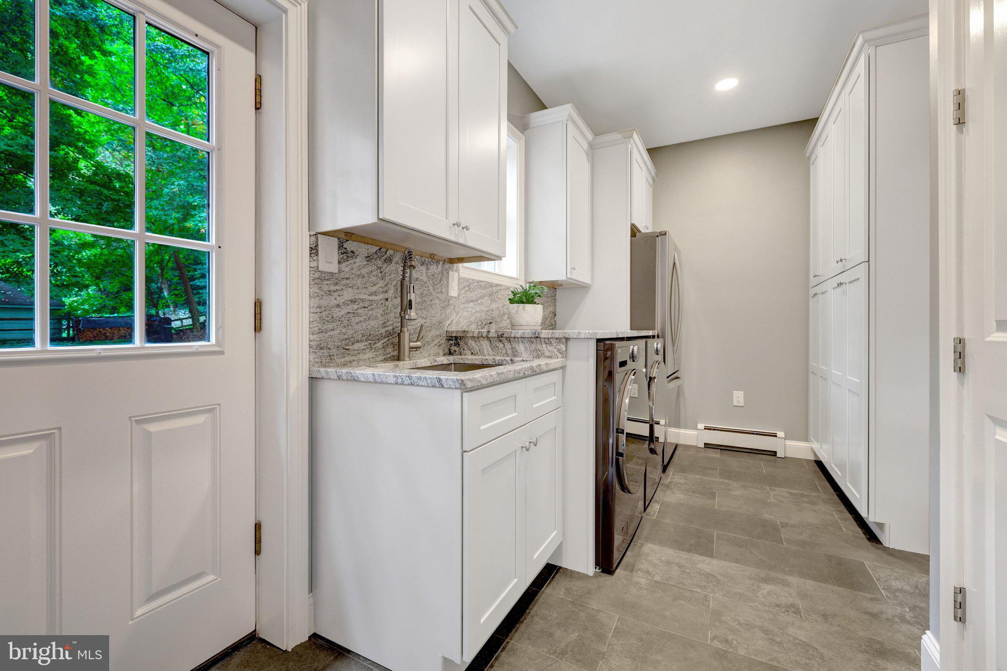 10015 Saddle Road Vienna, VA 22181 - Photo 33 of 95 STUNNING Laundry Room w/ TONS of storage!