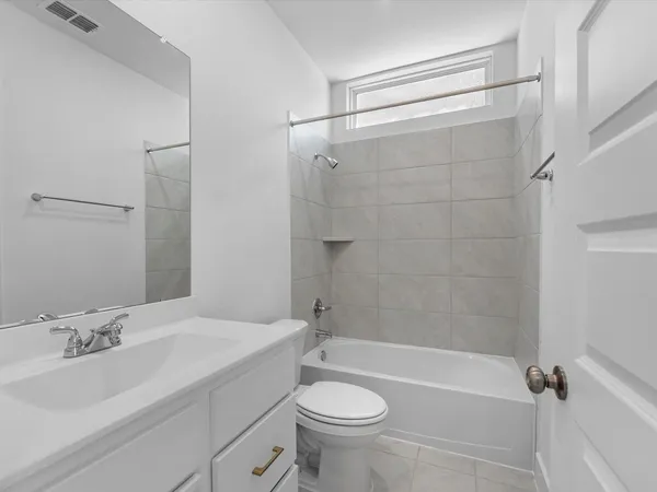 a bathroom with a sink a toilet and a bathtub