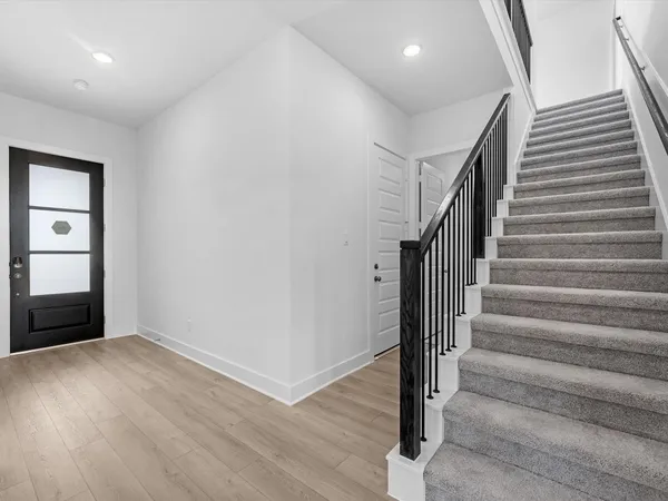 a view of entryway with wooden floor