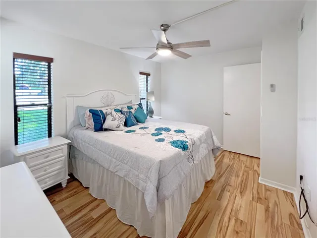 a bedroom with bed and a window