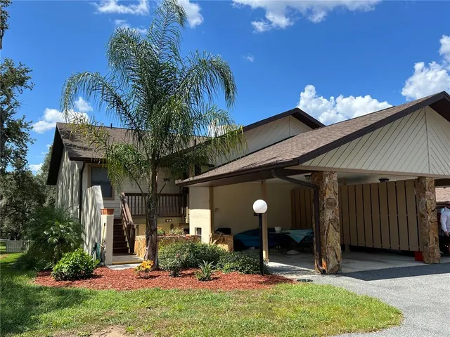 a view of a house and a yard