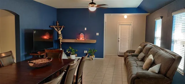 a living room with furniture and a flat screen tv