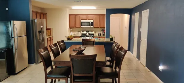 a view of a dining room with furniture