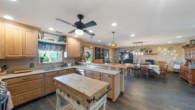 a kitchen with a table and chairs in it