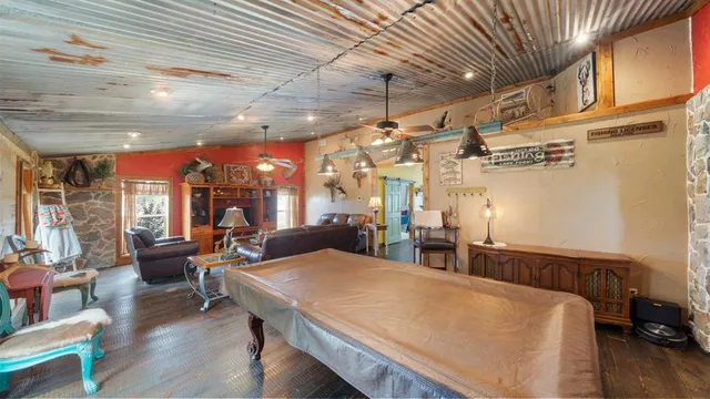 a living room with lots of furniture and a table