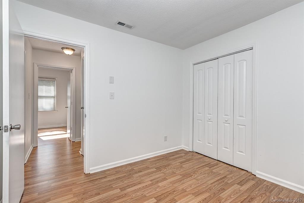 1705 Rushing Street, Unit 38 Monroe, NC 28112 - Photo 11 of 21 wooden floor in an empty room