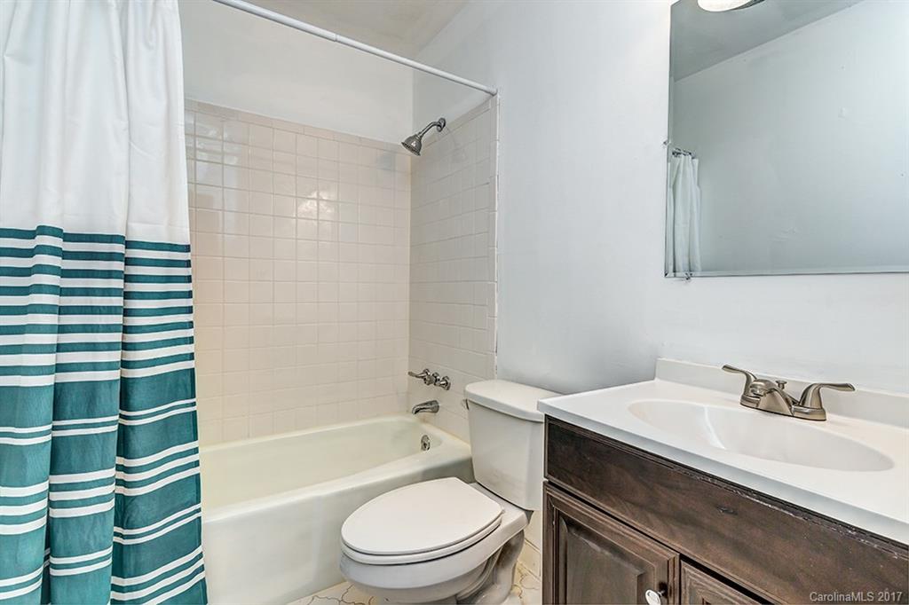 1705 Rushing Street, Unit 38 Monroe, NC 28112 - Photo 14 of 21 a bathroom with a sink toilet and shower