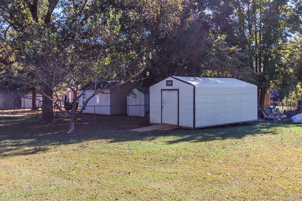 1705 Rushing Street, Unit 38 Monroe, NC 28112 - Photo 15 of 21 a view of a backyard with tree s