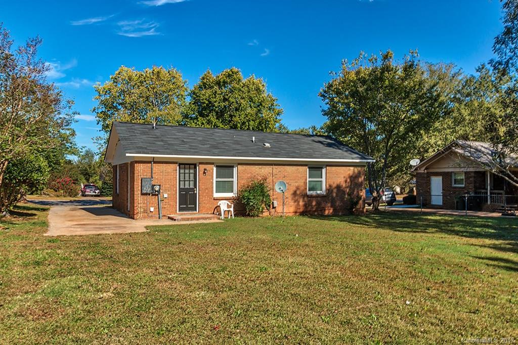 1705 Rushing Street, Unit 38 Monroe, NC 28112 - Photo 17 of 21 a view of a house with a yard and potted plants