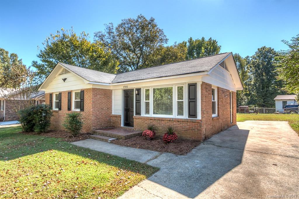 1705 Rushing Street, Unit 38 Monroe, NC 28112 - Photo 19 of 21 a front view of a house with garden