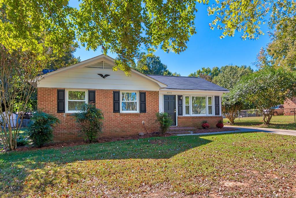 1705 Rushing Street, Unit 38 Monroe, NC 28112 - Photo 21 of 21 front view of a house with a yard
