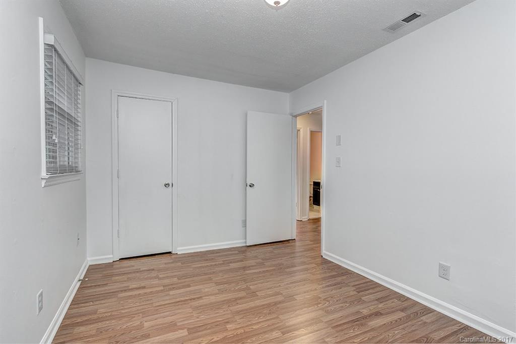 1705 Rushing Street, Unit 38 Monroe, NC 28112 - Photo 10 of 21 a view of an empty room with wooden floor