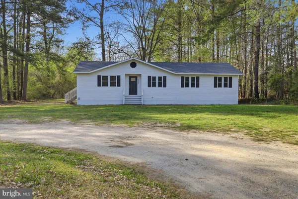a front of a house with a yard