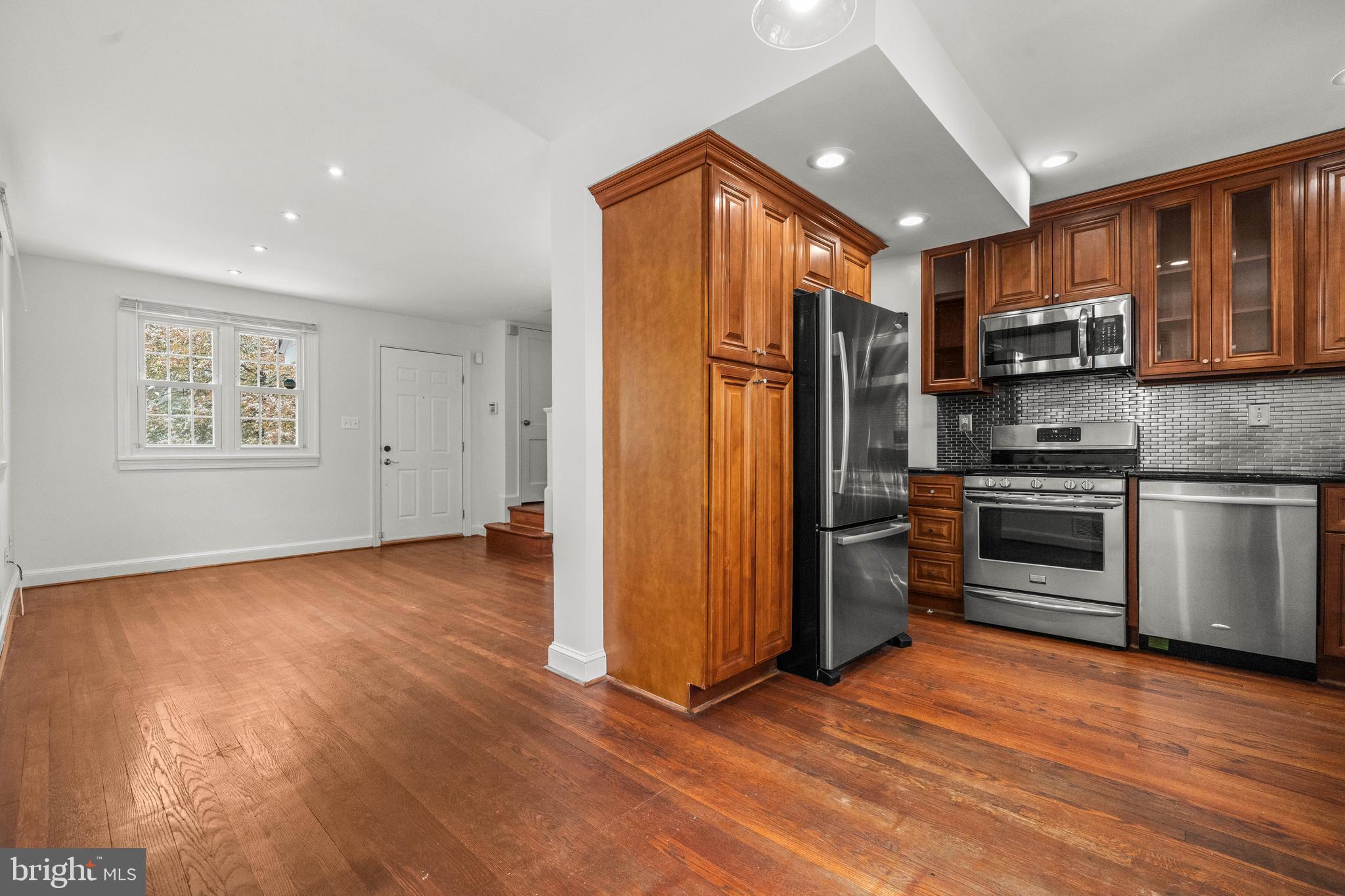 4244 Hildreth Street Southeast Washington, DC 20019 - Photo 11 of 31 a view of kitchen with stainless steel appliances granite countertop a refrigerator stove and a sink